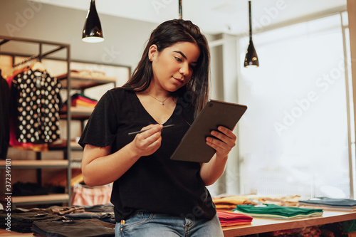 Fotografie Latin woman owner of small business
