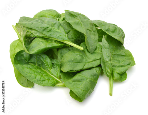 Fresh leaves of spinach on white background