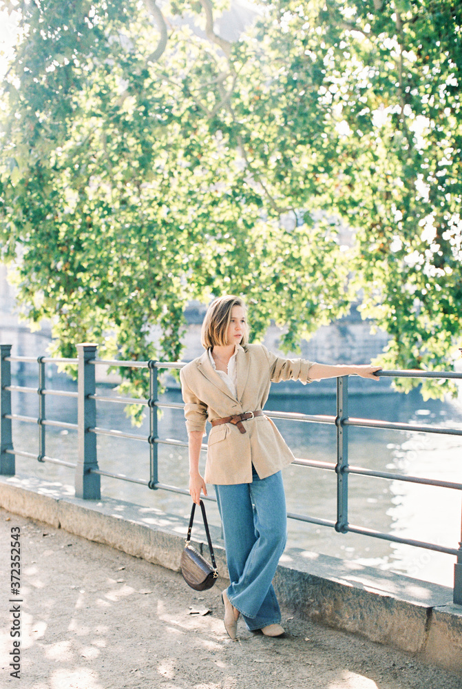 young woman by the river in the city young woman by the river in the city