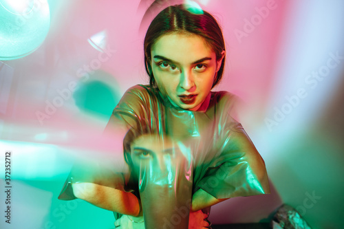 Kaleidoscopic reflections of Asian futuristic model photo