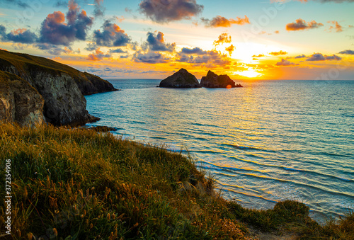 Gull rocks at sunset in Hollywell Bay in Cornwall photo