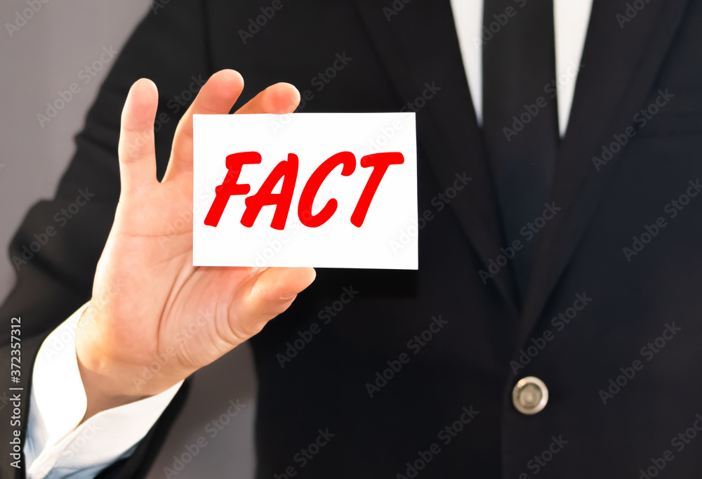 ManBusiness card with the word facts in the hand of a businessman.y People Holding the Red Word Facts, Isolated ManBusiness card with the word facts in the hand of a businessman.y People Holding the Red Word Facts, Isolated