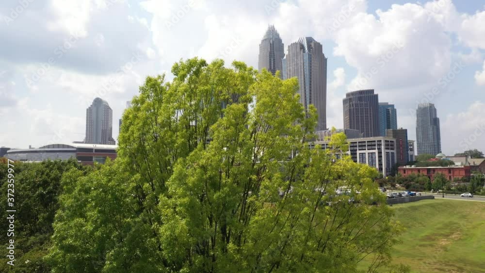Charlotte City Skyline North Carolina Spectrum Center Sunny Partly Cloudy Summer Sunrise Sunset Night Aerial 4K Charlotte City Skyline North Carolina Spectrum Center Sunny Partly Cloudy Summer Sunrise Sunset Night Aerial 4K