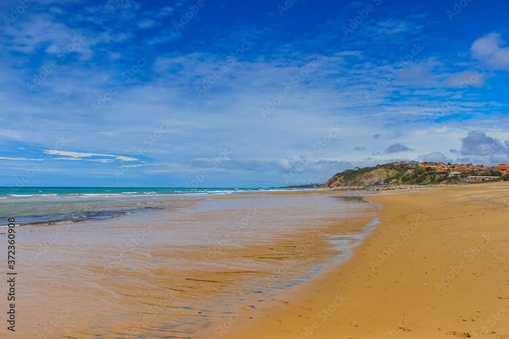 Beautiful landscape with ocean, sea, mountains, blue sky and white clouds