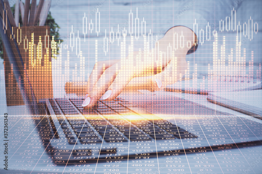 Multi exposure of woman hands typing on computer and forex chart hologram drawing. Stock market analysis concept. Multi exposure of woman hands typing on computer and forex chart hologram drawing. Stock market analysis concept.