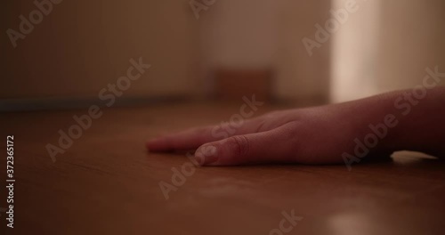 Wallpaper Mural A woman's hand lies motionless on the floor as a shard of bright light shines in through the bathroom door. Torontodigital.ca