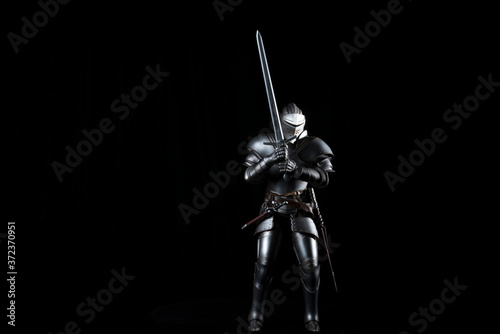 knight with sword blue velvet background