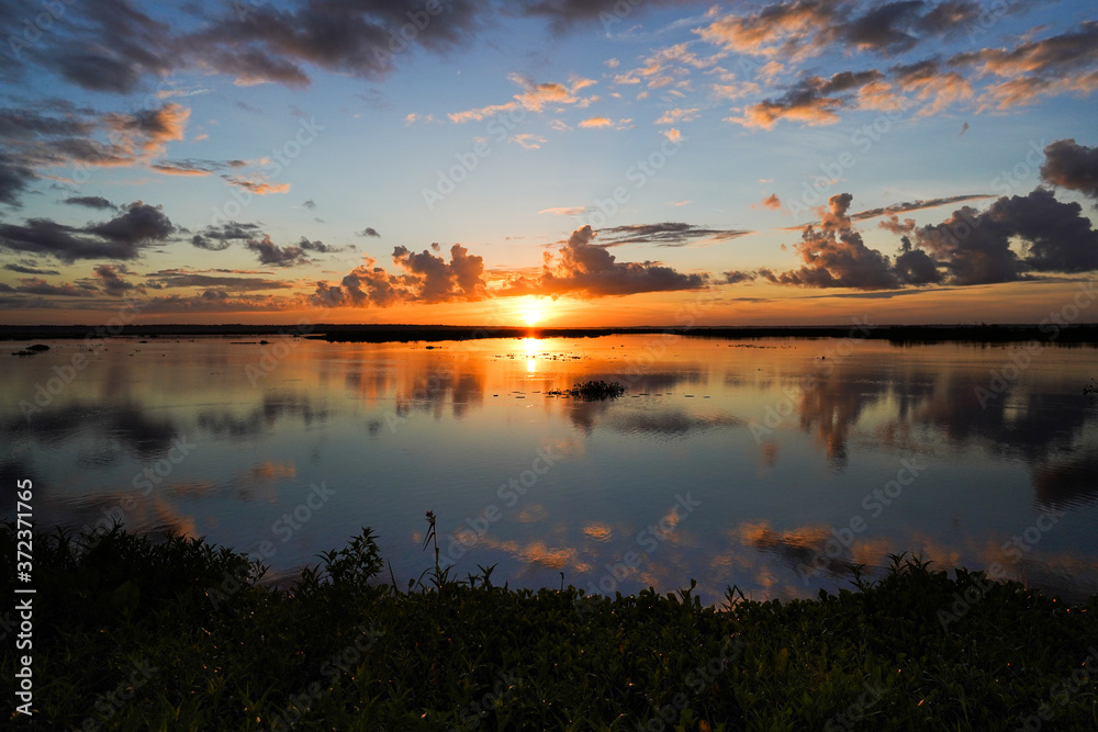 Naklejka premium sunrise over the lake