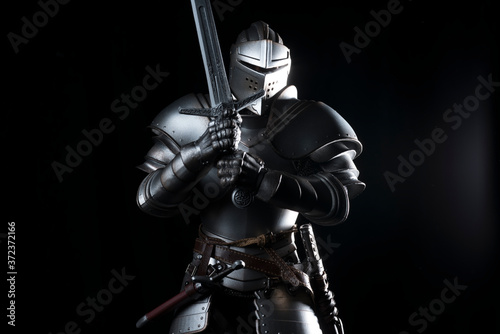 knight with sword blue velvet background