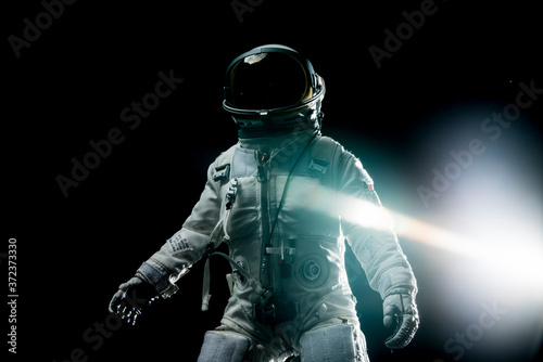 astronaut with lens flares and black background