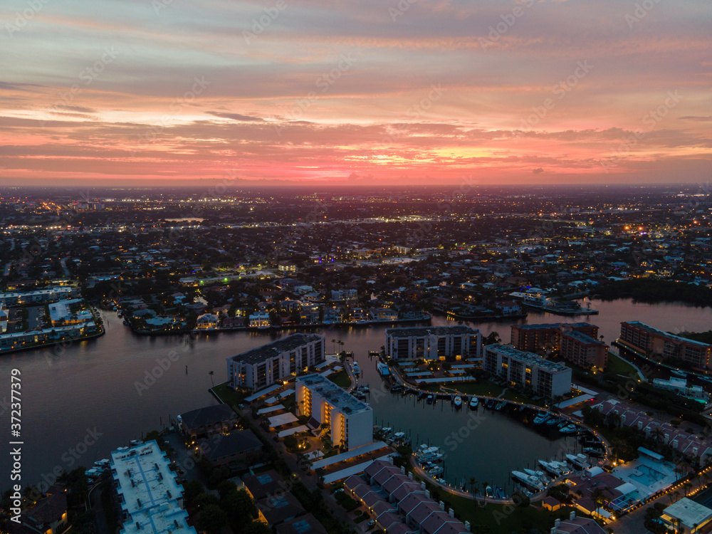 Naklejka premium aerial view of the city at sunset
