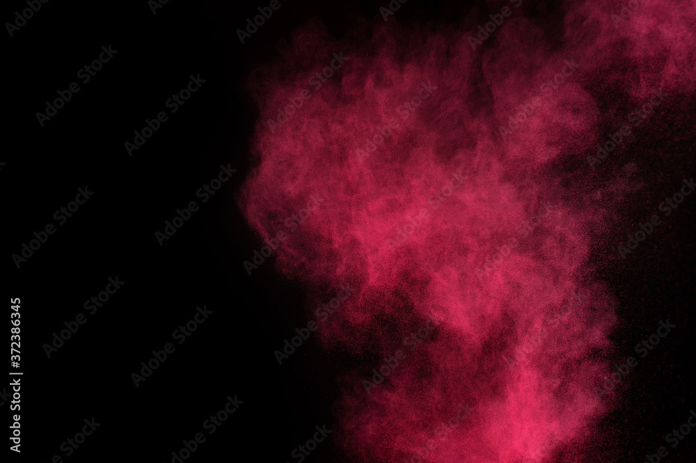 Red and pink powder explosion on black background. Colored powder cloud. Colorful dust explode. Paint Holi. Red and pink powder explosion on black background. Colored powder cloud. Colorful dust explode. Paint Holi.