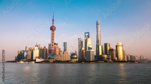 Shanghai - City view with skyscrapers, Oriental Pearl Tower and river with ships. 4K resolution time lapse.