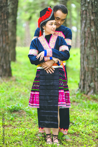 Portrait of Hmong couple in the pine wood, Wedding portrait of Hmong couple in the park.