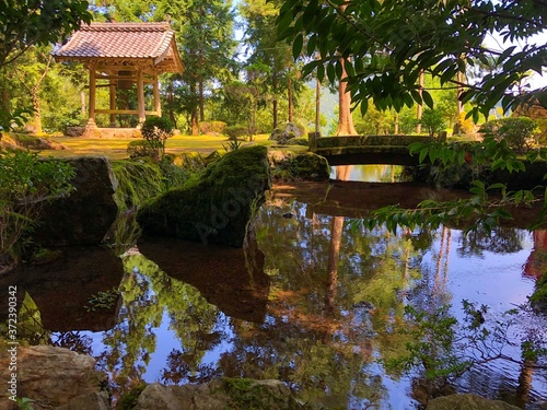 Public park with pond and buildings in Tsuruga city, Japan.