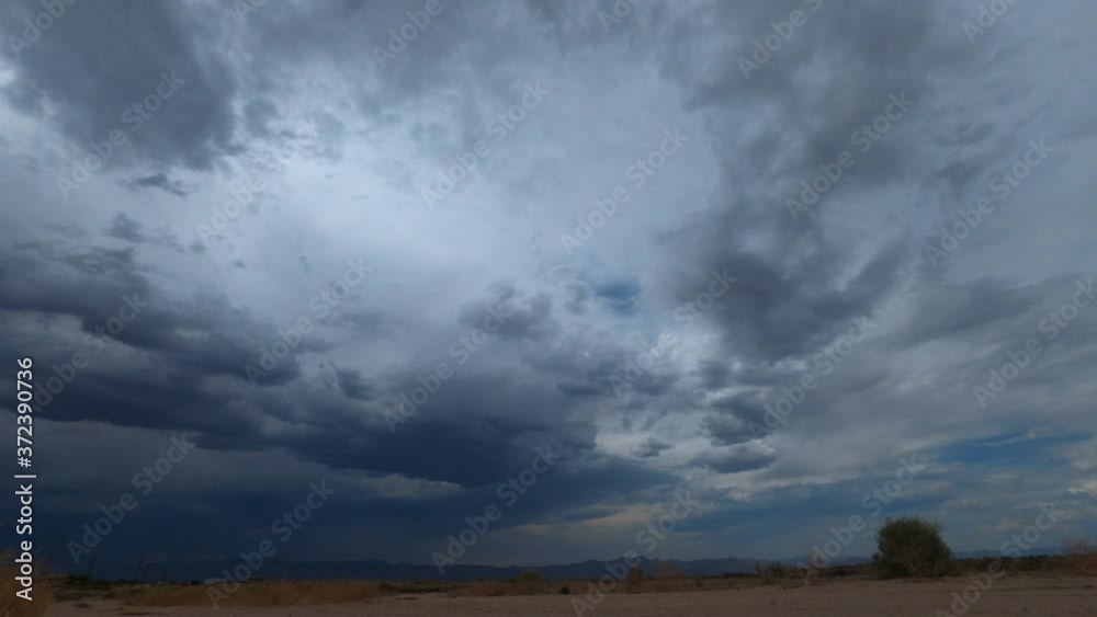 Storm clouds threaten to flood the desert landscape in this dramatic cloudscape time lapse Storm clouds threaten to flood the desert landscape in this dramatic cloudscape time lapse