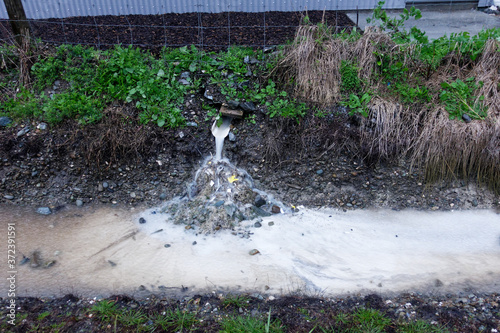 Polluted storm water run-off from an industrial site, Motueka, New Zealand. photo