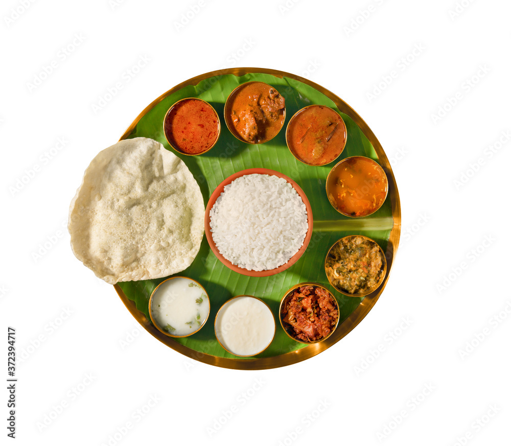 south india meals, meals served on banana leaf brass plate , traditional south indian cuisine