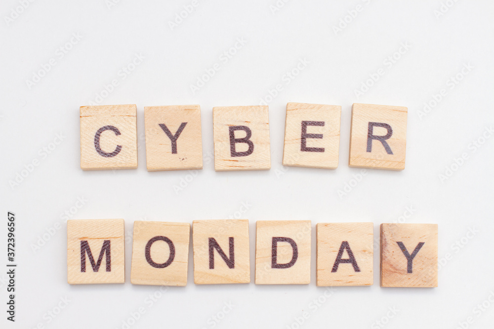 Word CYBER MONDAY made from wooden cubes on white. Selective focus Word CYBER MONDAY made from wooden cubes on white. Selective focus