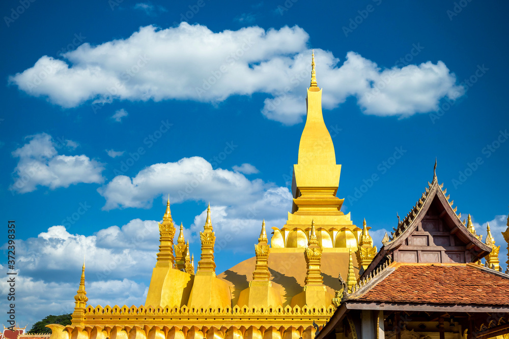 Naklejka premium Pha That Luang is gold large Buddhist stupa and the most important national monument in Laos and national symbol, Vientiane, Laos.