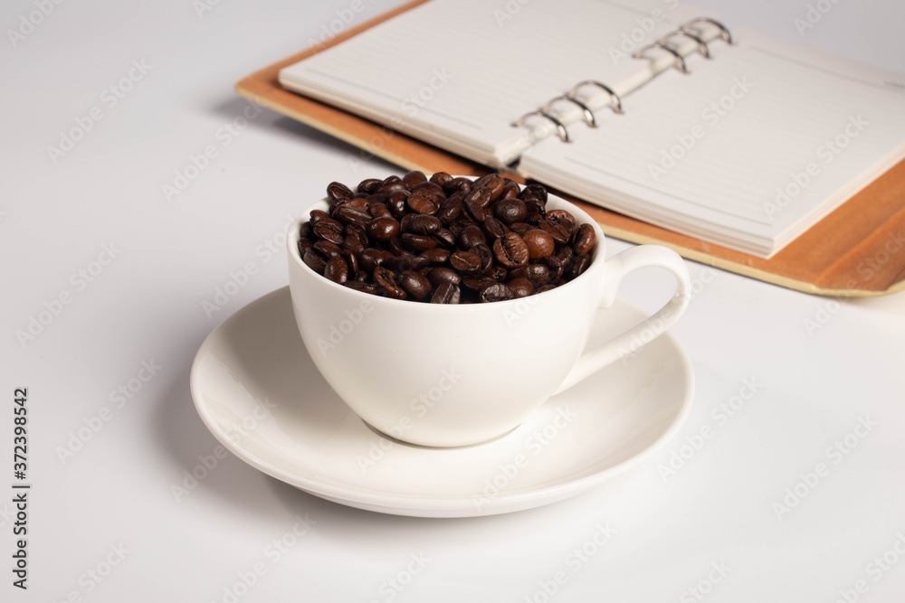cup of coffee and notebook cup of coffee and notebook