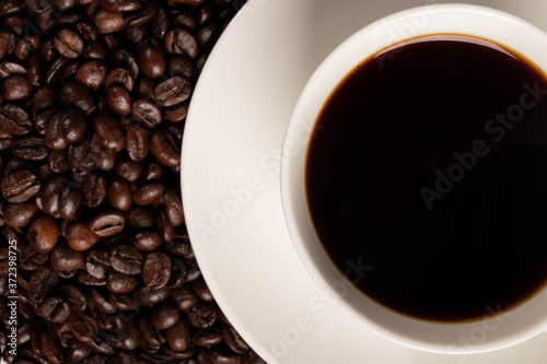 the cup of coffee with beans