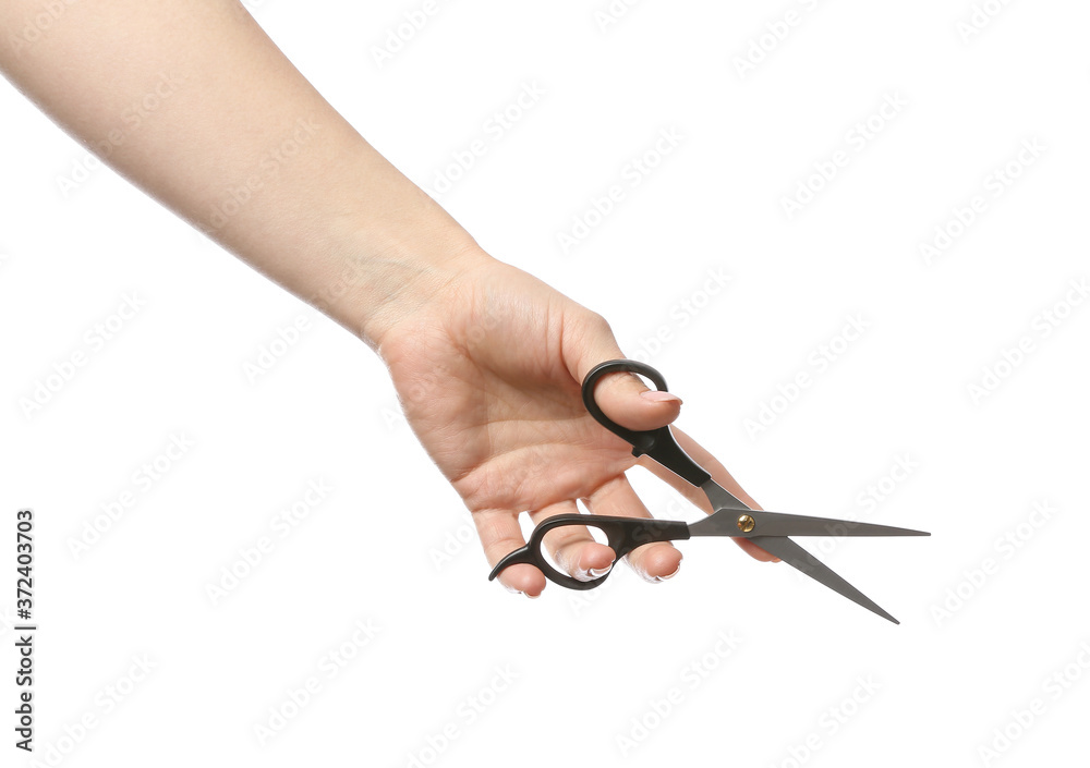 Obraz premium Female hand with hairdresser's scissors on white background