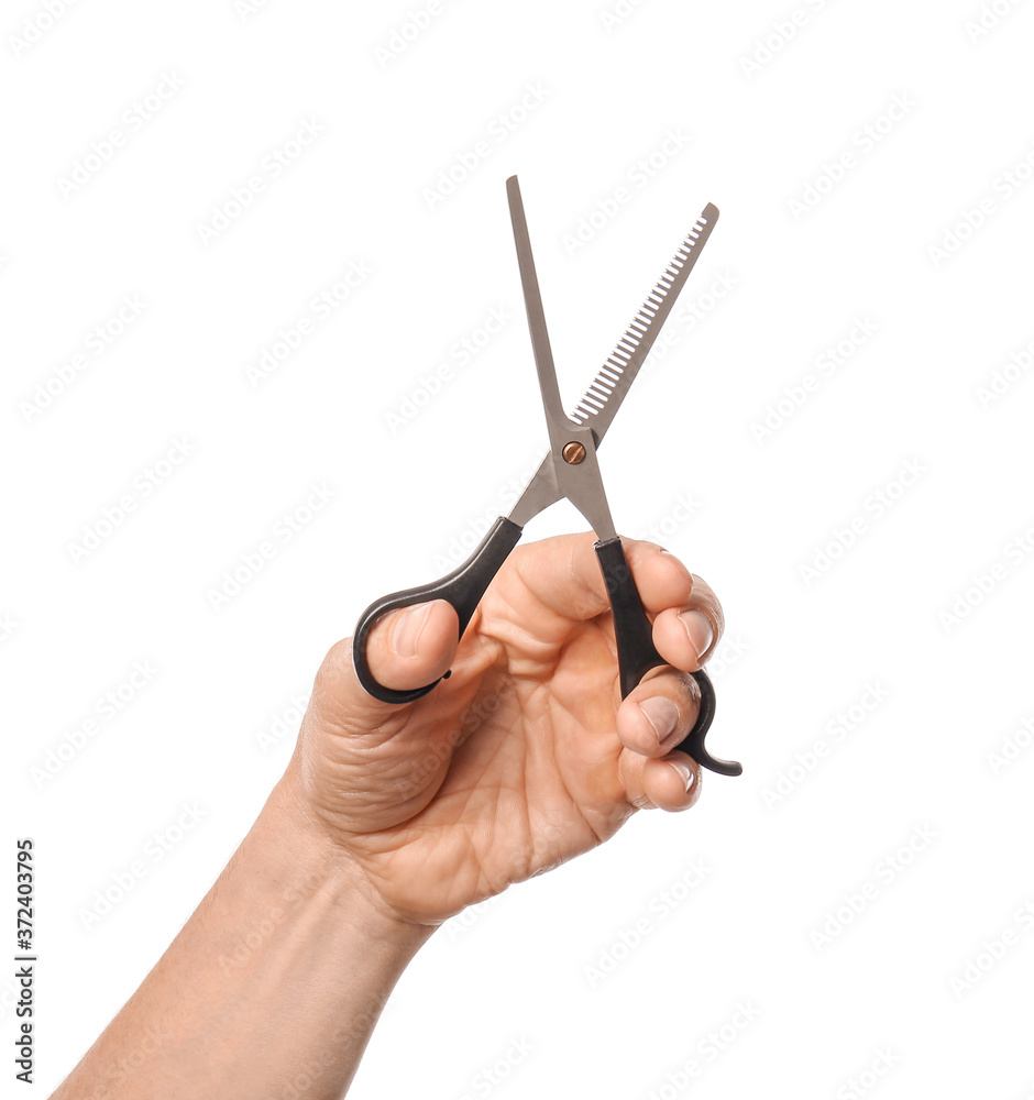 Male hand with hairdresser's scissors on white background Male hand with hairdresser's scissors on white background