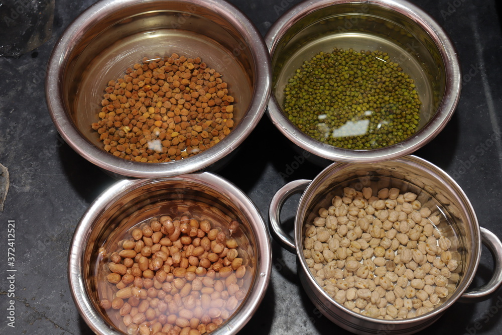 Fresh green gram beans and peanuts with channa dal on black background Fresh green gram beans and peanuts with channa dal on black background