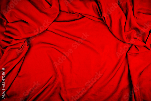 Dramatic closeup folds of dark red or wine red drapery (with copyspace for text)