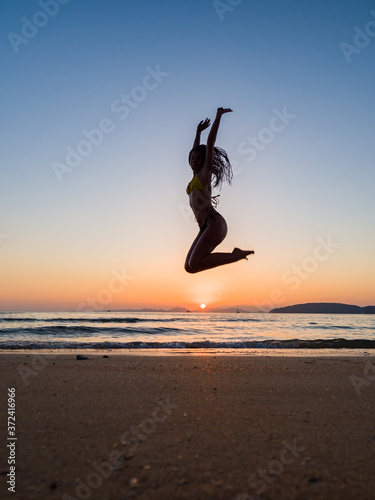 Woman in swiming suit posing on the beach