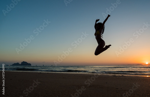 Woman in swiming suit posing on the beach