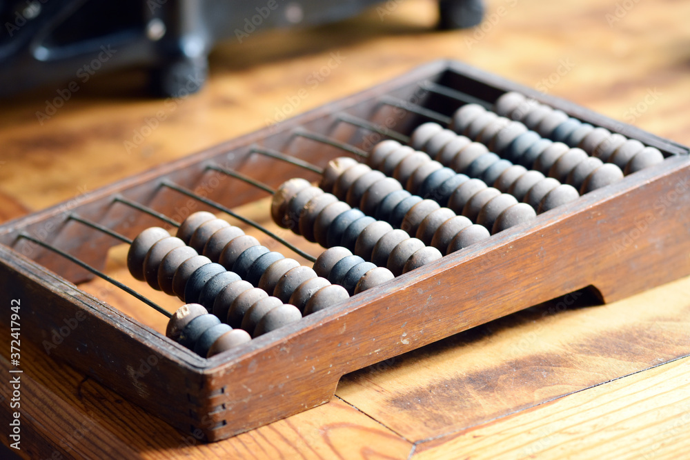 Wooden Dusty Abacus, Many Times Used. Close-up Wooden Dusty Abacus, Many Times Used. Close-up