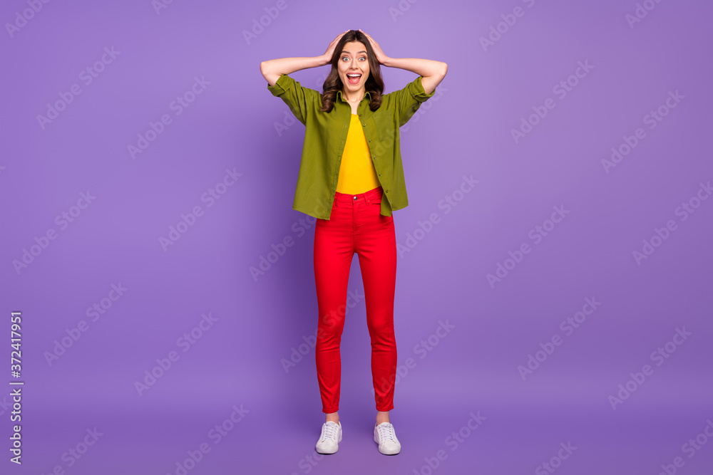 Full size photo of astonished girl have free time trip see wonderful bargain impressed scream touch hands head wear casual style clothes sneakers isolated purple color background Full size photo of astonished girl have free time trip see wonderful bargain impressed scream touch hands head wear casual style clothes sneakers isolated purple color background