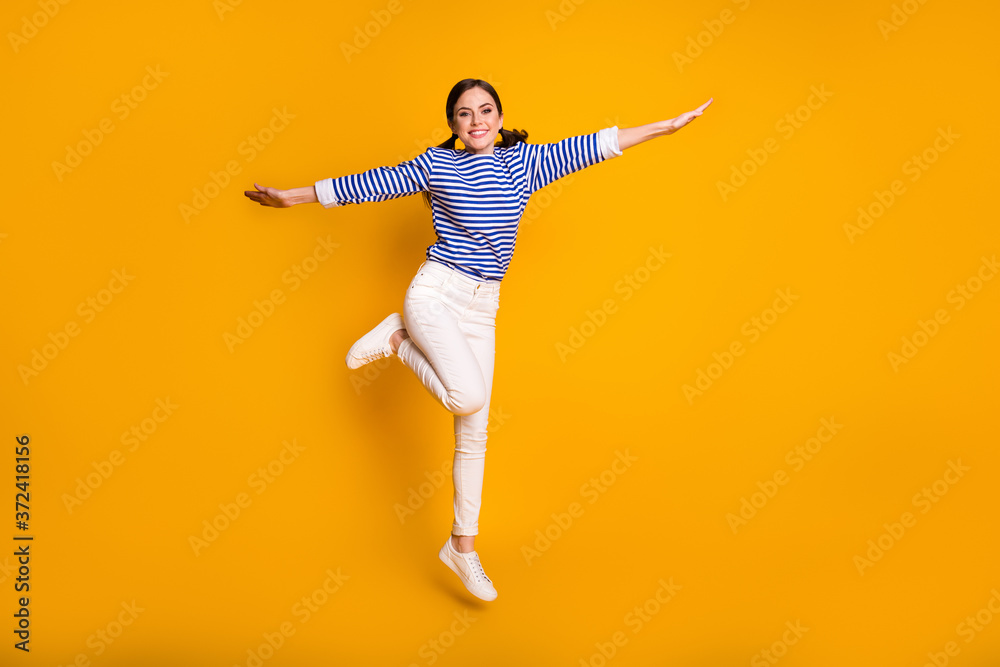 Full size photo of nice cute sweet girl jump hold hand enjoy summer weekend free time wear good look outfit isolated over bright color background