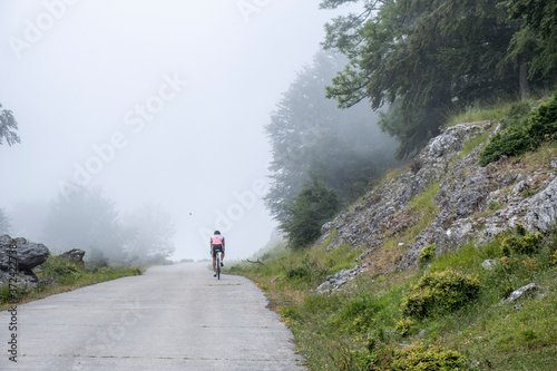 cyclist ascending the Uarte-Arakil track, Sierra de Aralar, Navarra, spain