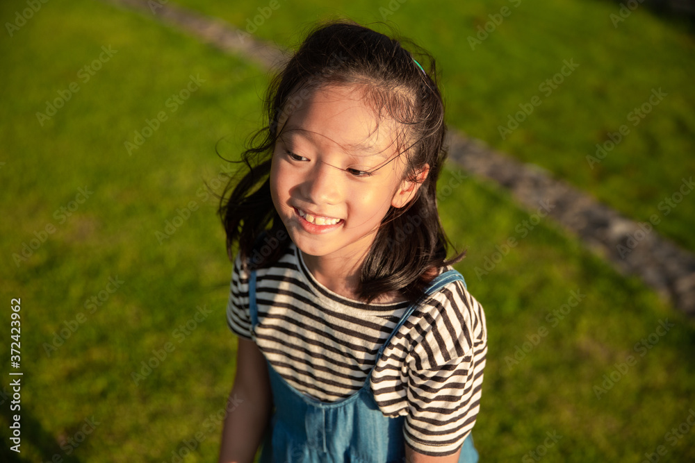Portrait asian little girl smiling outdoor