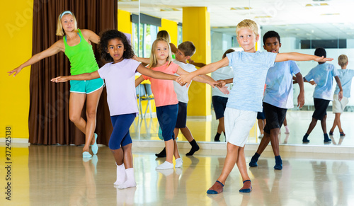 Children learn dance movements in dance class. High quality photo
