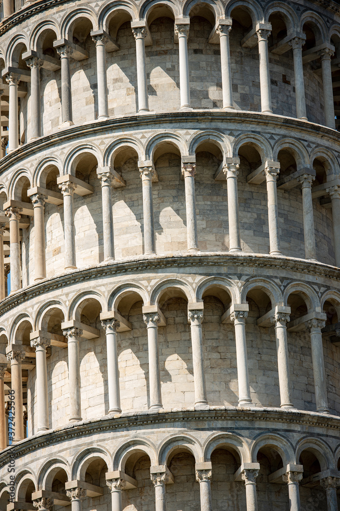 Closeup of Leaning Tower of Pisa, bell tower of the Cathedral (Duomo di Santa Maria Assunta) in Romanesque style. (1173 - XIV Century). Tuscany, Italy, Europe