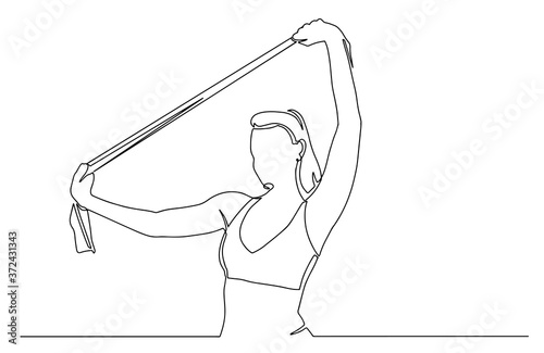 Portrait of woman in sportswear exercises with resistance band. Continuous line drawing. Fitness female model doing stretching workout.. concept of woman holding resistance band at fitness studio