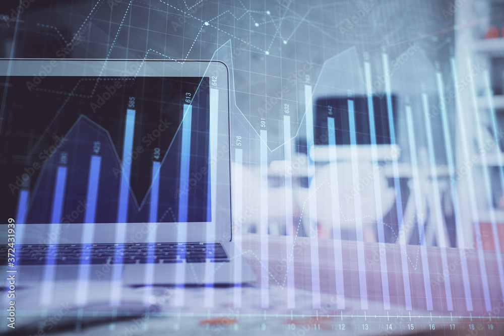 Forex Chart hologram on table with computer background. Multi exposure. Concept of financial markets.