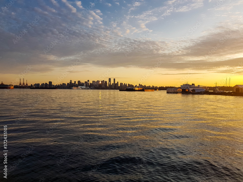 Beautiful Vancouver skyline shot seen from north at sunset.