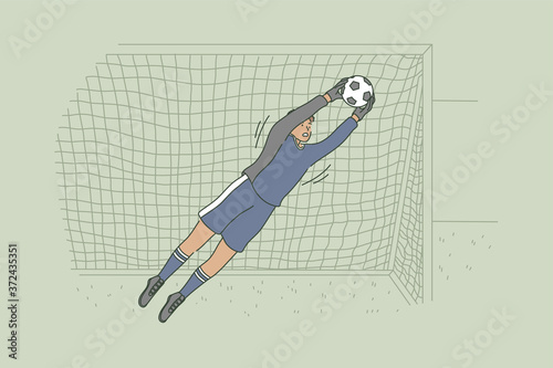 Sport, game, playing, match, competition, hobby concept. Young professional african american man guy soccer goalkeeper character catching ball on stadium field during championship. Active lifestyle.