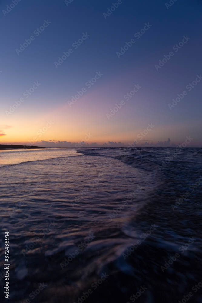 Soft focus images of Sunset ocean horizon, beautiful sky clouds sunset scenery Soft focus images of Sunset ocean horizon, beautiful sky clouds sunset scenery