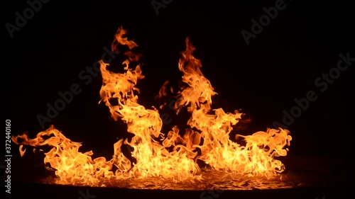 Outdoor fire on the floor at night.