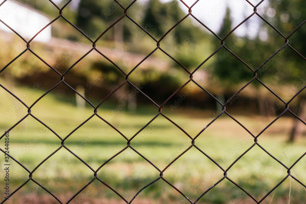 iron chain link fence against sky iron chain link fence against sky
