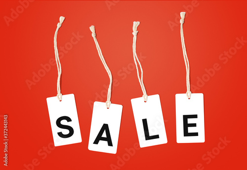 The inscription Sale on a red background. Label tags with inscription sale.