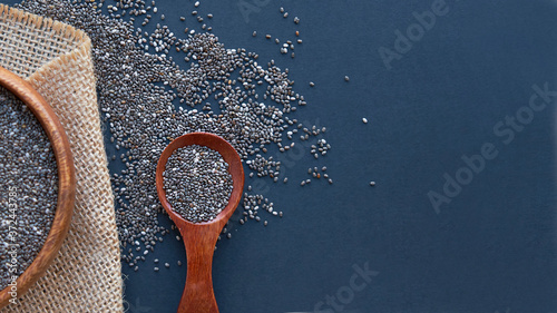 Chia seeds on wooden spoon isolated on white background. Chia grains that can be eaten to reduce weight well and high in protein and phosphorus,high in fiber and low calories. clean food and superfood photo