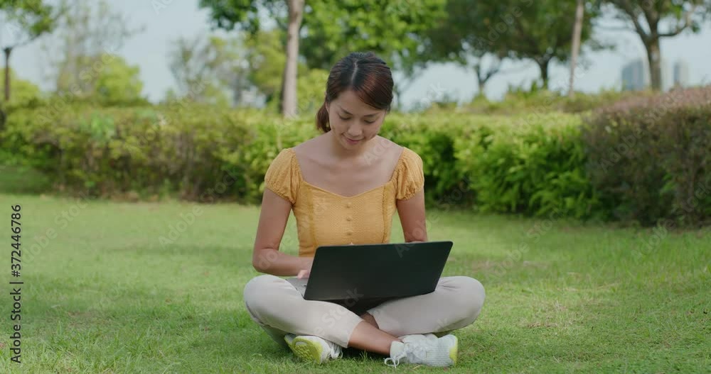 Woman work on computer at outdoor park Woman work on computer at outdoor park