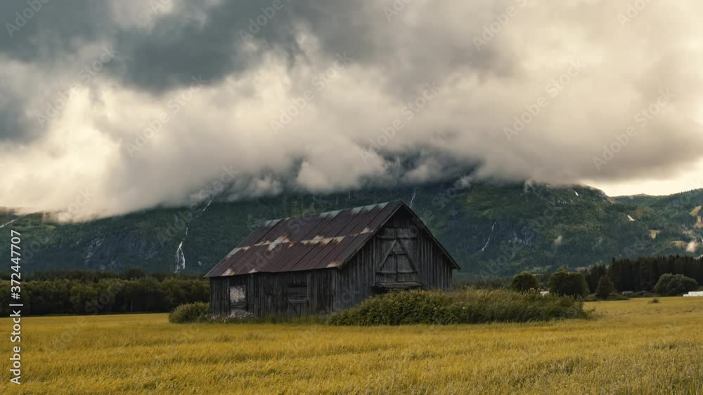 Abandoned Barnhouse On The Lush Field In Hemsedal, Norway On A Cloudy Autumn Day - timelapse - zoom-out shot Abandoned Barnhouse On The Lush Field In Hemsedal, Norway On A Cloudy Autumn Day - timelapse - zoom-out shot